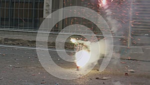 Firecracker bursting in the street. Las Fallas celebration, Spain