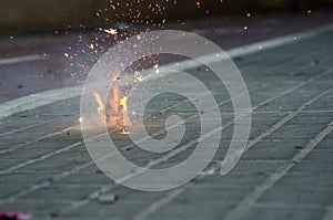 Petardo encendido, detalle de las chispas durante las fallas. photo