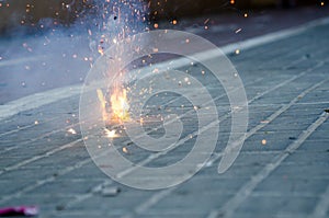 Petardo encendido, detalle de las chispas durante las fallas. photo