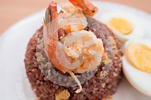 Fired brown rice with shrimp, carrot and boiled egg healthy clean food none oil added photo