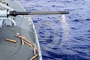 Fired cannon from a warship in sea