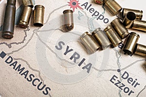 The fired cases and bullets from rifle. Background view on section area of Aleppo, Syria. photo