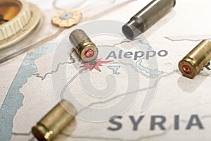 The fired cases and bullets from rifle. Background view on section area of Aleppo, Syria. photo