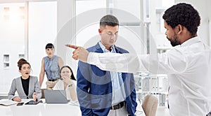 Fired, fight and angry boss is frustrated with employee and upset manager pointing out embarrassing colleague. Gesture
