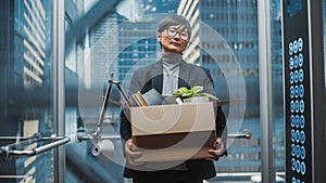 Fired Manager Going Down from Office in a Glass Elevator in Modern Business Center. Sad Specialist