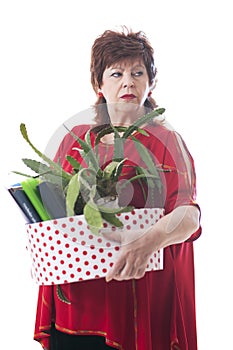 Fired woman carrying a box of personal items