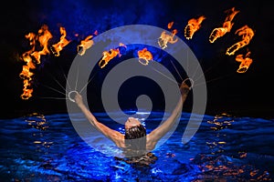 Firedancer woman in water