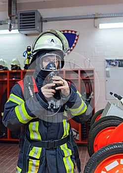 Firefighter in action and with oxygen bottle and mask - Serie Firefighter