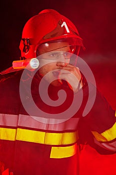 Firefighter in action using walkie-talkie