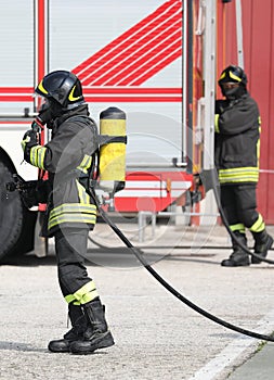 Firefighter with apparatus and the fire engine