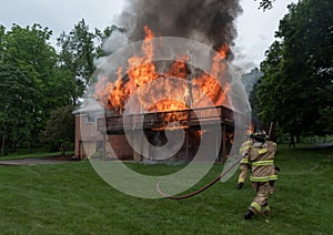 Firefighter attempting to put out the fire