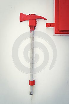 Firefighter axe on the cruiser boat wall