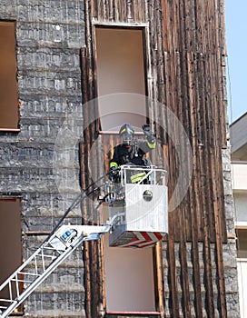 Firefighter in the basket of the pumper fire engines