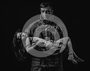 Firefighter carrying child photo