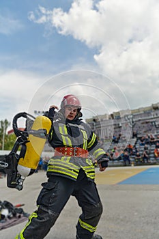A firefighter dons the essential components of their professional gear, embodying resilience, commitment, and readiness