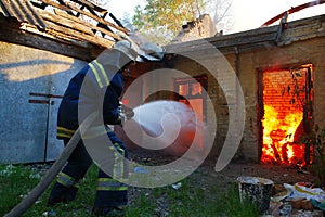 Firefighter extinguishes fire