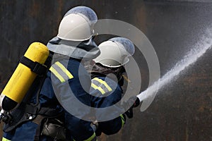 Firefighter extinguishes fire