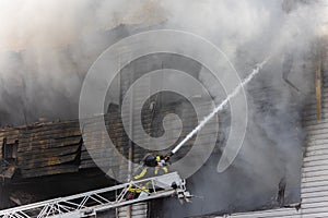 Firefighter extinguishes fire