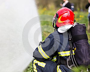 Firefighter extinguishes fire