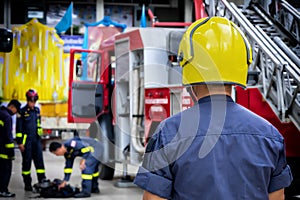 Firefighter, fireman. Emergency safety. Protection, rescue from danger. Fire fighter in protective helmet. Adult man, hero in