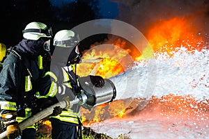 Firefighter - Firemen extinguishing a large blaze photo
