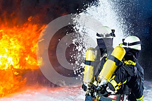 Firefighter - Firemen extinguishing a large blaze photo