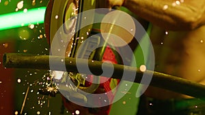 Firefighter fitness model, close-up of a firefighter cutting metal