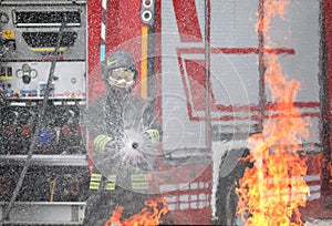 firefighter with helmet and uniform in action