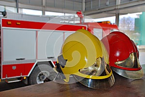 Firefighter helmets with a fire truck