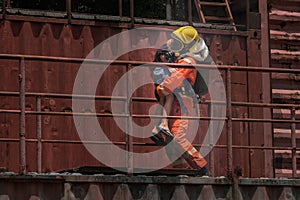 Firefighter holding child boy to save him in fire and smoke Firemen rescue the boys from fire