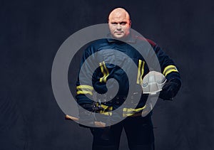 Firefighter holds the axe.