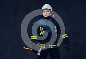 Firefighter holds the axe.