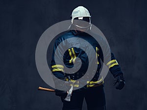 Firefighter holds the axe.