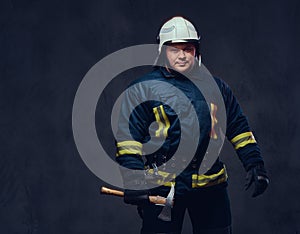 Firefighter holds the axe.