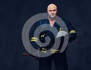 Firefighter holds the axe.