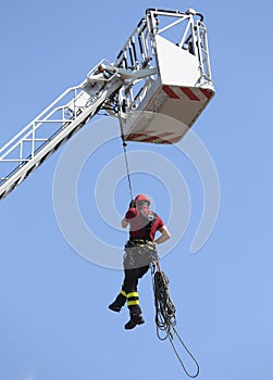 firefighter hung the rope climbing in the firehouse photo