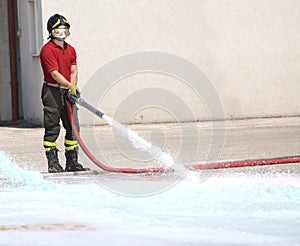 Firefighter with the hydrant mind tests the flow of water during