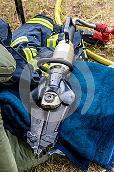 Firefighter Hydraulic Rescue Tool Resting on Gear