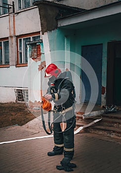 firefighter man preparing to extinguish the fire