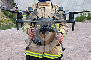 Firefighter operating drone in search and rescue