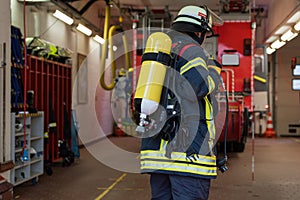 Firefighter with oxygen cylinder in the fire department