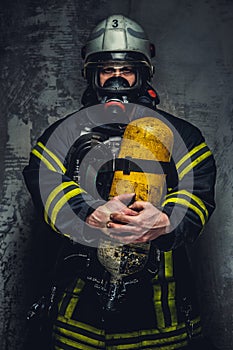 Firefighter in oxygen mask.