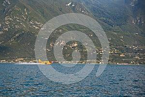 Firefighter plane taking water from Garda lake