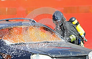Firefighter with protective helmet and oxygen cylinder