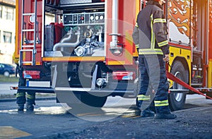 Firefighter pumper truck. Fire truck with fire fighting equipment