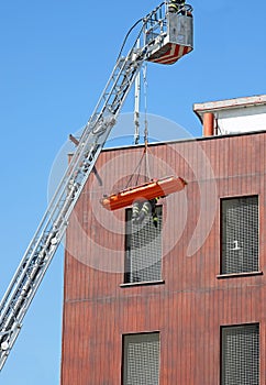 firefighter during the recovery of the injured with the stretche