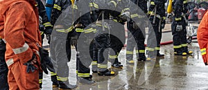 Firefighter Rescue team training in fire fighting extinguisher. Firefighter teamwork fighting with flame using fire hose chemical