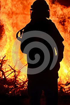 Firefighter rescue worker at scene rural bushfire