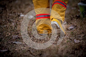 Firefighter suit walking on grass