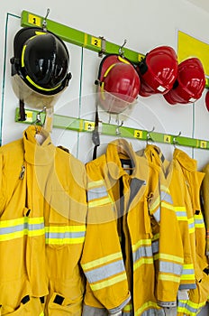 Firefighter suits and helmets hanging